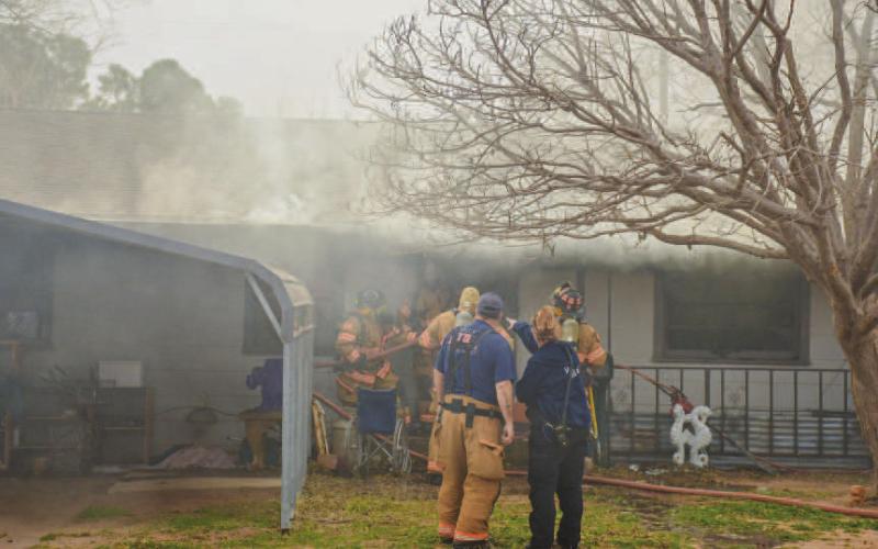 STRUCTURE FIRE - The Levelland Fire Department (LFD), Levelland Police Department (LPD) and Levelland Emergency Management Services (LEMS) resonded to a report of a fully involved structure fire located in the 1800 block of Lee Street, Friday afternoon. (Staff photo by Dom Puente)