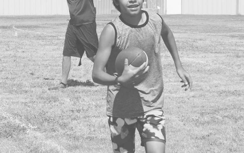BALL CARRIER- Morton athlete Zachary Huckabee worked on carrying the ball and making his grip stronger. (Staff Photo by Aalijah Soliz)