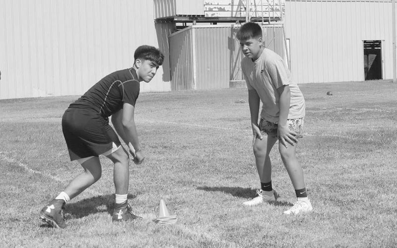 HEAD TO HEAD- Morton athletes Luis Aguirre and Mason Enriquez were working on WR and DB drills to help sharpen their skills. Morton held a football camp this week that spanned Monday through Wednesday. (Staff Photo by Aalijah Soliz)