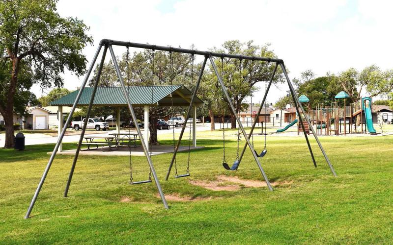 17TH STREET PARK – Also known as Double U or Triangle Park, the park on 17th Street has swings, a pavilion and a playground. It is also conveniently placed, making it a great place for neighborhood gatherings.(Staff photo by Ada Niederhauser)