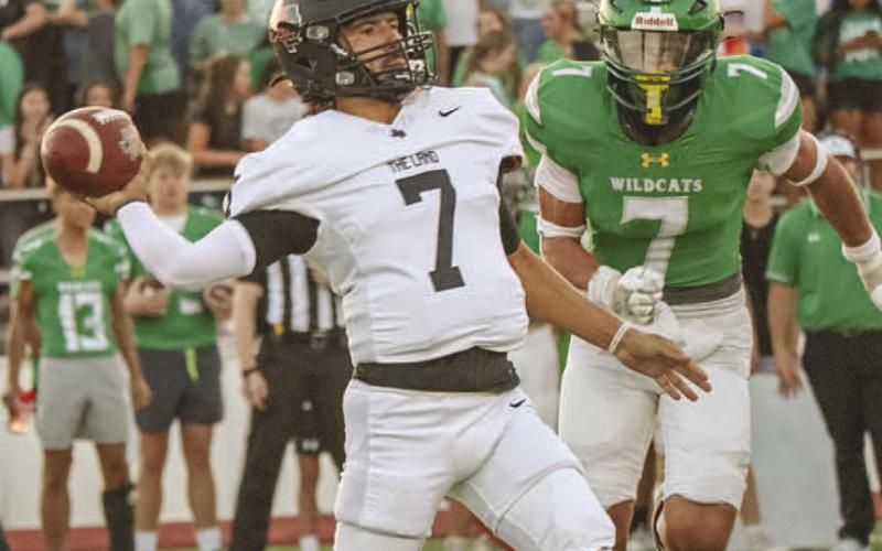 UNDER PRESSURE - Levelland Lobo Boston Winfield stood tall in the pocket under pressure this past Friday against the Idalou Wildcats on the road. (Staff photo by Aalijah Soliz)