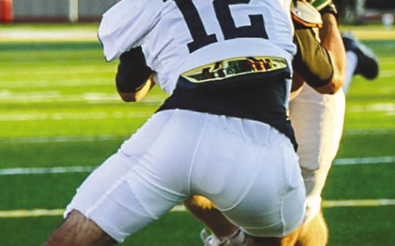 NOT SO FAST - Levelland Lobo Josh Diaz wrapped up the wide receiver for the open field tackle this past Friday against the Wildcats on the road. (Staff photo by Aalijah Soliz)