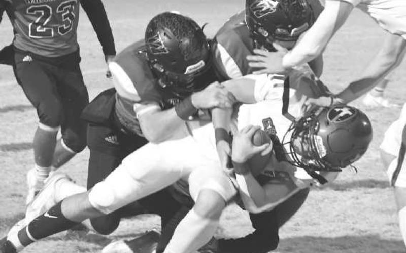 TAKE DOWN - Stifling defense helped the Whitharral Panthers to a 60-12 win over the Groom Tigers in a UIL Class 1A-2 High School Football Bi-District game last Thursday in Silverton. Whitharral will face the Klondike Cougars on Friday at 7 p.m. in Hermleigh.