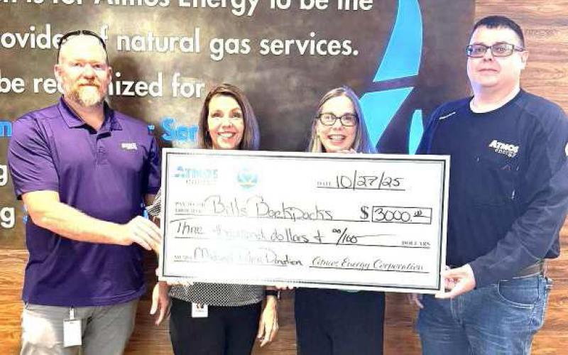 MUCH NEEDED DONATION- Michael Palma and Atmos Energy donated $3,000 to Bill’s Backpacks to support the organization’s efforts to fight hunger. (