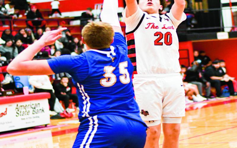 LONGORIA PULLS UP - Levelland Lobo Zavien Longoria pulls up from mid-range during their home game against Lubbock Christian this past Thursday night. Longoria would have four points in the loss. (Staff photo by Jentezen Smith)