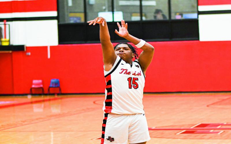 MARTIN SHOOTS TWO - Levelland Lobo Noah Martin shoots two free throws during their home game against Lubbock Christian this past Thursday night. Martin would lead the Lobos with eight points on the night. (Staff photo by Jentezen Smith)