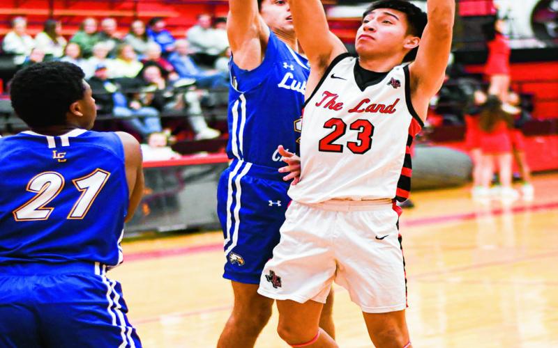 MARTINEZ IN THE PAINT - Zeke Martinez goes up for a shot in the paint during their home game against Lubbock Christian this past Thursday night. Martinez would end with two points. (Staff photo by Jentezen Smith)