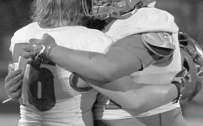 TOUGH NIGHT FOR SENIORS- Roughneck seniors Landon Sehon and Jeff Rodriguez console each other after they were eliminated from the playoffs. The Sundown Roughnecks’ football season came to an end Thursday night in Hereford with a 49-8 loss to the defending Division 2 State Champion Stratford Elks. (Photo Courtesy of Chris Bratcher)