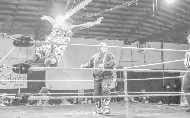 AIRBORNE - Mack the Franchise jumps from the top rope onto Skar at the wrestling event held July 1 at 7pm. (Staff Photo by Aalijah Soliz)
