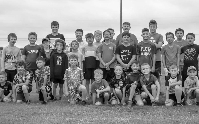 FOOTBALL FUNDAMENTALS - Smyer Bobcat All-Sports Camp participants learned football fundamentals and sportsmanship Wednesday at Smyer High School. The camp was open to incoming second graders through incoming ninth graders. Campers were taught the fundamentals for basketball, volleyball, football and baseball throughout the week. (Staff Photo by Victoria Byrnes)