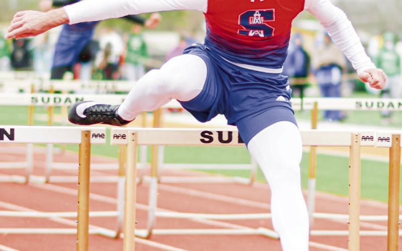 TRAIL LEG PULL THROUGH - Sundown Roughneck Nathan McAdams pulls his trail leg through over the hurdle during the 110-meter hurdles at the Son Qualls Relays this past Friday at Sudan High School. McAdams would run a 15.20. (Staff photo by Jentezen Smith)