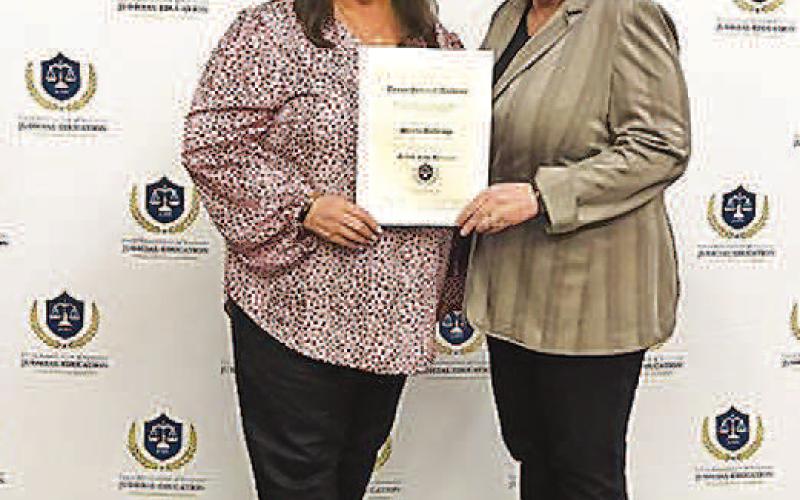 TAC RECOGNITION - Pictured is Hockley County Judge Sharla Baldridge (left) receiving her award which is given to county judges who demonstrate a commitment to judicial excellence by surpassing the state’s minimum education requirements. Judge Baldridge was recognized as a Fellow of the Texas Judicial Academy by the Texas Association of Counties (TAC).