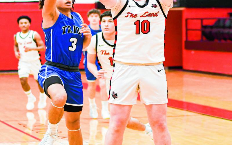 GIBBS FROM RANGE - Levelland Lobo Graham Gibbs shoots a three-pointer during their district basketball game against Lakeview this past Friday night at Levelland High School. (Staff photo by Jentezen Smith)