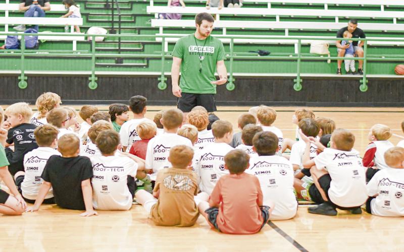 NEXT GENERATION OF EAGLES - Ropes Head Boys Basketball Coach Cameron Copley coaches up his basketball campers during their Tuesday morning session at the Ropes High School gym. The morning session was for second through fifth graders. (Staff photo by Jentezen Smith)