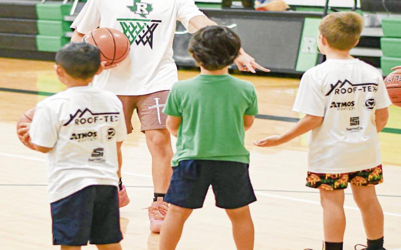 COACH ‘EM UP - Ropes Eagle Cayden Martinez coaches up Eagle campers Cason Coggins, Collier Williams and Adrian Hernandez this past Tuesday at the Ropes High School gym. (Staff photo by Jentezen Smith)