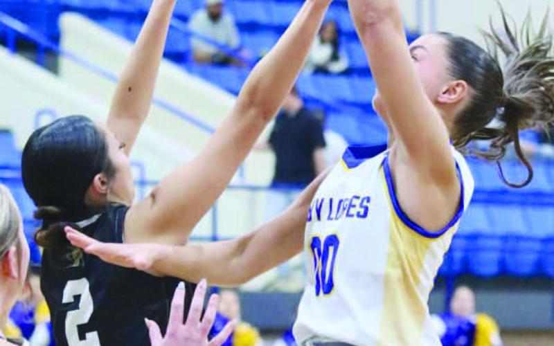FLOATER - Whiteface Lady Lope Lainey Sanders shot a floater over the Cowgirls defense last Friday night at home to take the District Championship at home. (Photo courtesy of Holly Crutcher)