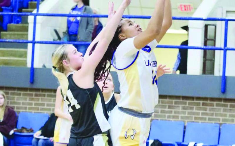 LAY UP - Whiteface Antelope Tymmyah Olenga layed the ball up through the Plains defense during the team’s game this past Friday night at home. (Photo courtesy of Holly Crutcher)