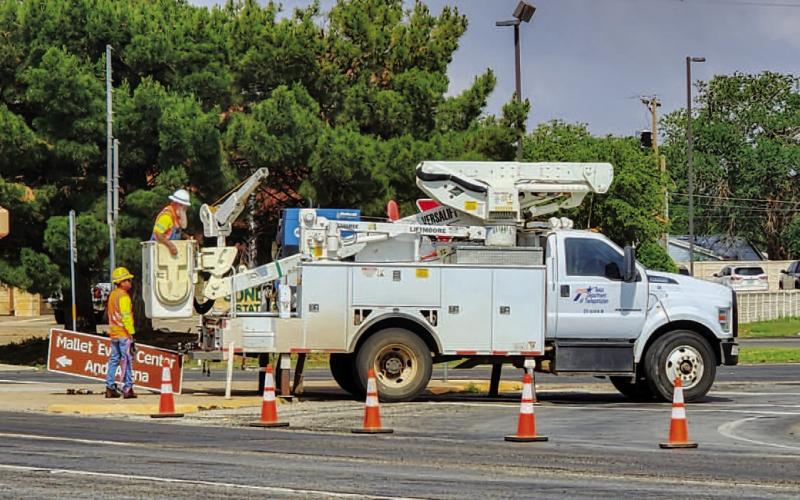 ROUTINE WORK - The Texas Department of Transportation was doing signage maintanence at the intersection of Clubview Drive and Avenue H Wednesday morning. Closing off the turn-off to get onto Avenue H from Clubview Drive, TxDOT was replacing signs. (Staff Photo by Dom Puente)