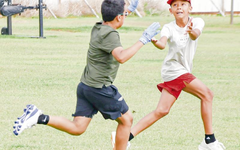 ONE-ON-ONE COMPETITION - Antelope campers Zayden Garay (left) and Parker Smith (right) compete against each other in a one-on-one drill at the Whiteface Sports Skills Camp this past Wednesday at Whiteface High School. (Staff photo by Jentezen Smith)