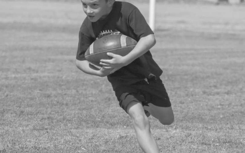 NO FUMBLING - Whitharral Panther Alex Fredrick carried the ball with both hands this past Monday during the Whitharral All-Sports Camp at the Football Field. (Staff photo by Aalijah Soliz)