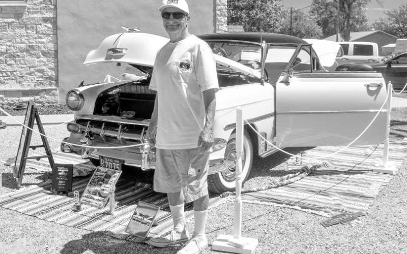 SMYER VFD- The Smyer Voluneteer Fire Department hosted its first fundraiser on Saturday to raise money for a new station. Pictured is Benny “El Chuco” Hernandez from Lubbock that participated in the car show . He is the owner of this 1954 Chevy Bel Air. The engine is a 235 inline 6 125hp and transmission is a 3 speed powerglide. Hernandez said he has won many car shows and enjoys it. (Staff photo by Emily Campos)