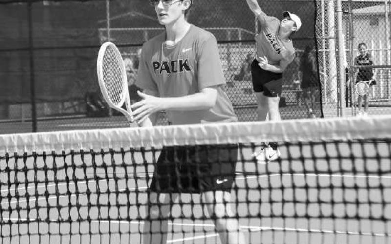 SET &amp;amp; SERVING – Brady Houston gets in position for the set while Reese Payton serves it in a double’s matchup against Big Spring at the Levelland Tennis Courts on August 2. Houston and Payton would end up going undefeated in their matches on the day. (Staff photo by Jentezen Smith)