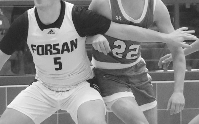 FOCUSED - Ropes Eagle Reese Williams kept his eye on the ball while fighting for positioning underneath the basket last Friday night against Forsan. (Staff photo by Aalijah Soliz)