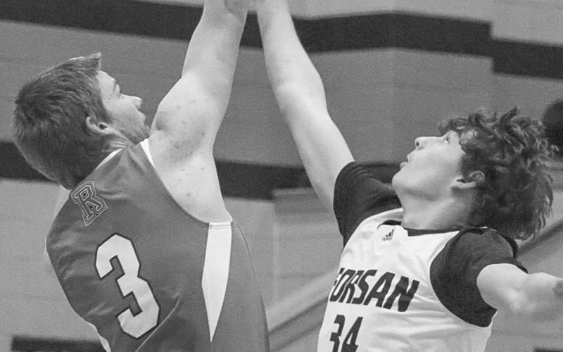 VERTICAL - Ropes Eagle Kade Franklin jumped at the start of the game to try to earn the team the first possession this past Friday night in Lanesa. (Staff photo by Aalijah Soliz)