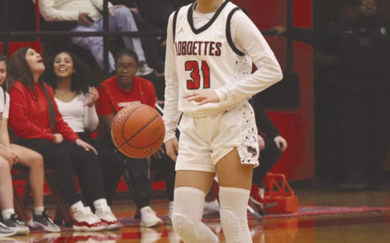 FOCUSED - Levelland Loboette Leilani Sanchez brought the ball up the court against the Big Spring Lady Steers this past Friday at home in the teams dominant win. (Staff photo by Aalijah Soliz)