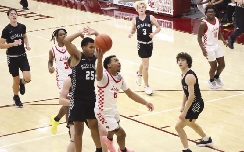 TOUGH FINISH - Levelland Lobo Jayden Castillo broke on the fast break during the teams contest in the Littlefield Tournament last week against the Bushland Falcons. (Staff photo by Aalijah Soliz)