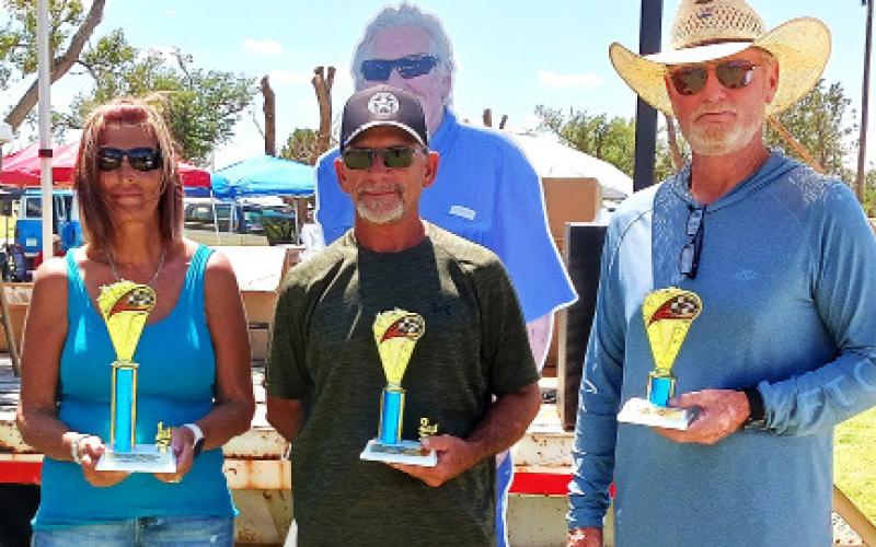 1950’S CLASSIC – Sandy Roberts, first place with a 1957 chameleon pickup; David Jones, second place for a 1956 orange and cream Chevy; and Tye Taylor, third place with a 1955 orange and cream Chevy.