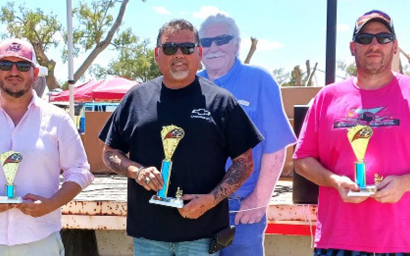 CUSTOM TRUCKS ’91-UP – Edgar Estrada, third place for a red 2003 Chevy Silverado; Jesse Garza, second place with a black 1996 Chevy pickup; and Andy Hogopoylos, second place for a blue 2000 Chevy Silverado.