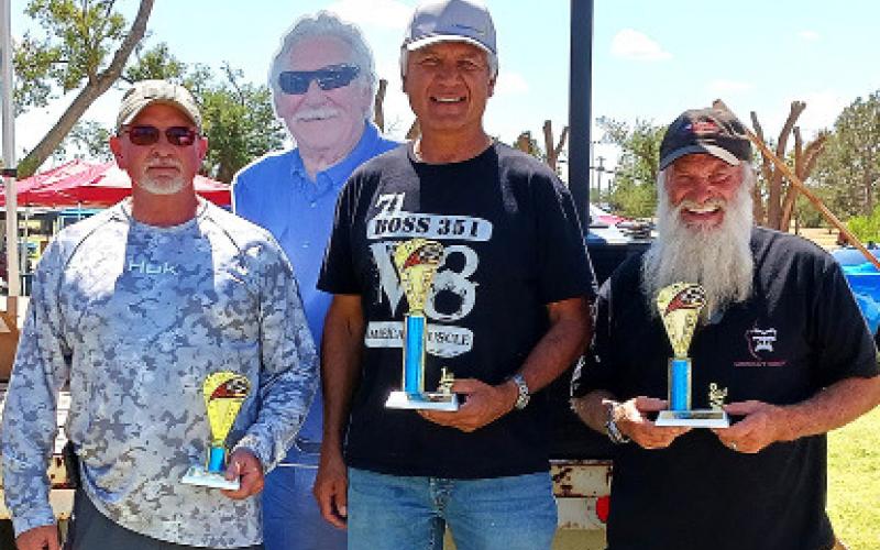 FORD MUSCLE CARS (64-81) – Jason Cox, third place for a black 1979 Ford Ranchero; Abel Rios, first place with a red 1971 Ford Boss 351; and Jeff Riedel, second place for a yellow 1967 Ford Fairlane. (Staff photo)