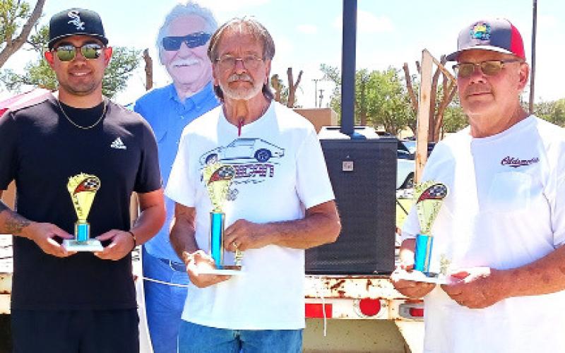 B.O.P. MUSCLE CARS (64-81) – Pictured from left: Matthew Rodriguez, third place for a white with red 1979 Pontiac Trans Am; Steve White, first place for a white 1973 Pontiac Trans Am; and Craig Simpson, second place with a black and gold 1972 Oldsmobile 442.