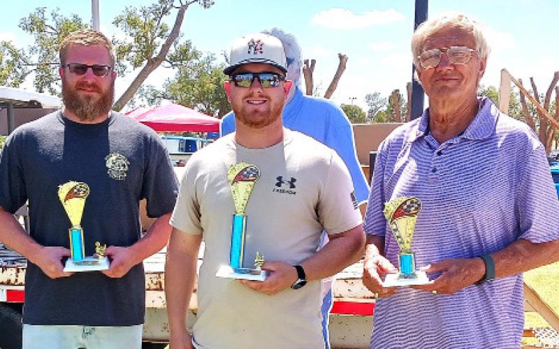 FENDER HOT/STREET RODS (49-Older) – Stephen Hunt, who received second place for a turquoise 1947 Ford Super Deluxe; Scott Lybarger, who won first with a red and white 1927 Dodge Sedan; and Lonnie Adrian, who, with Hellen Adrian, won third place for a purple 1937 Plymouth 4-door. (Staff photo)