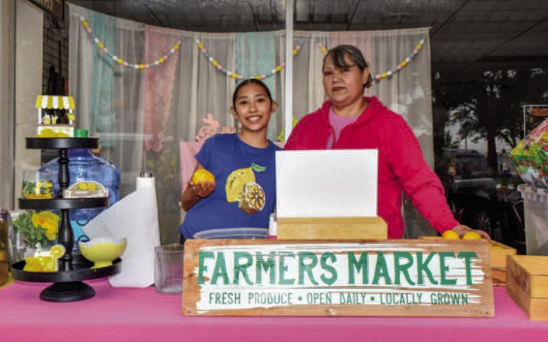 - Pictured are Reyna Morales and Marylee Barrera served their fresh lemonade on Saturdays for Main Streets Lemonade Day. (Staff photo by Hannah Woodrum)