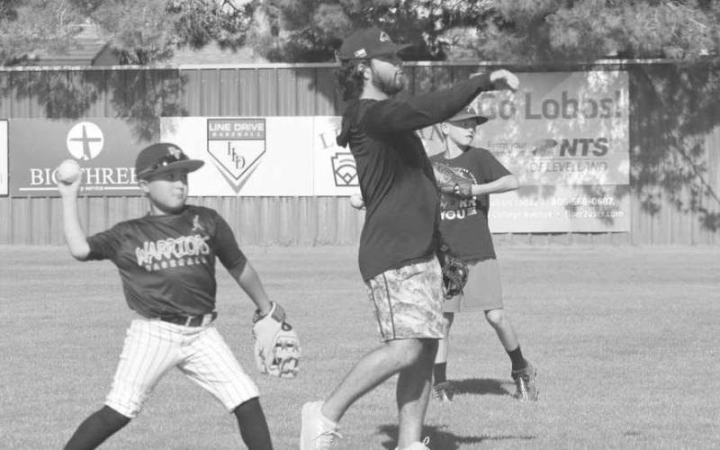 CATCH - Levelland Assistant Coach Brandon Coronado was tossing the ball with some kids at the Levelland Baseball Camp held at the Levelland High School last week. (Staff photo by Aalijah Soliz)