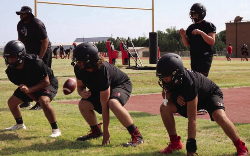 BIG DOGS - The Levelland Lobos linemen were getting to work with drills working with Linemen Coach Marlin Wynn. (Staff Photo by Aalijah Soliz)