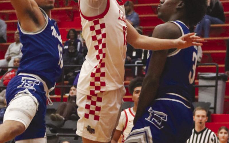 TOUGH BASKET - Levelland Lobo Nehemiah Sanchez got around the Matador defense for the tough layup during the team’s game this past Tuesday night. (Staff photo by Aalijah Soliz)
