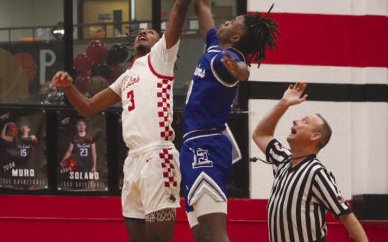 JUMP BALL - Levelland Lobo Eryk Jones jumped for the first possession of the game for his team during the team’s last district game against Estacado. (Staff photo by Aalijah Soliz)