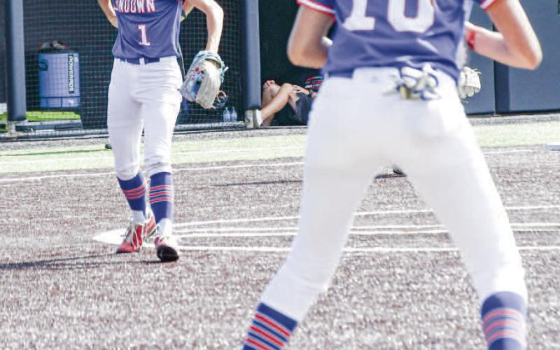 ROUTINE PLAY - Sundown Roughette Breigh Gregory makes a routine out, fielding the ball and throwing it to first baseman Araceli Ibarra during the State Semifinals at Abilene Christian University recently. (Staff photo by Jentezen Smith)
