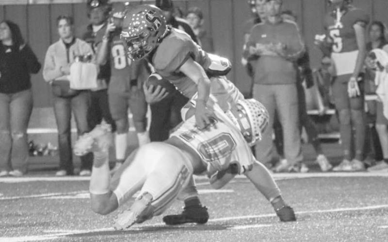 DIVING TACKLE - Ropes Eagle Brady Bryan dove at Sundown Roughneck Marcus Solis last Friday night in Sundown during both team’s district game. (Staff photo by Aalijah Soliz)