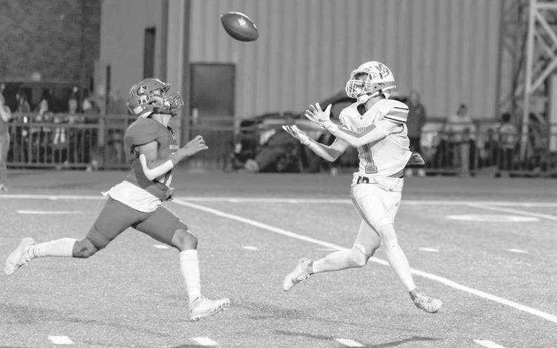 ON THE RUN - Ropes Eagle Reese Williams caught the ball on the run with Roughneck Marcus Solis in pursuit last Friday night in both team’s district games. (Photo courtesy of Donovan Martin)