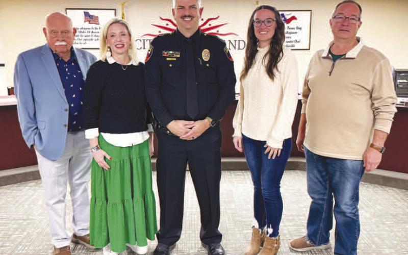 NEW CAPTAIN - Levelland Police Officer Ty Land was promoted to the rank of Captain during Monday’s City Council meeting. Land’s wife, Amy had the honor of pinning Captain Land with his family and fellow LPD officers and staff in attendance. Picture is Captain Land with the Levelland City Council (Staff photo by Dom Puente)