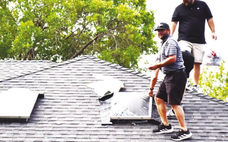 STORM SKYLIGHT REPAIR - Following the severe thunderstorm on Tuesday evening, there were numerous reports of skylights being knocked out by large hail. (staff photo by Lynda Work)