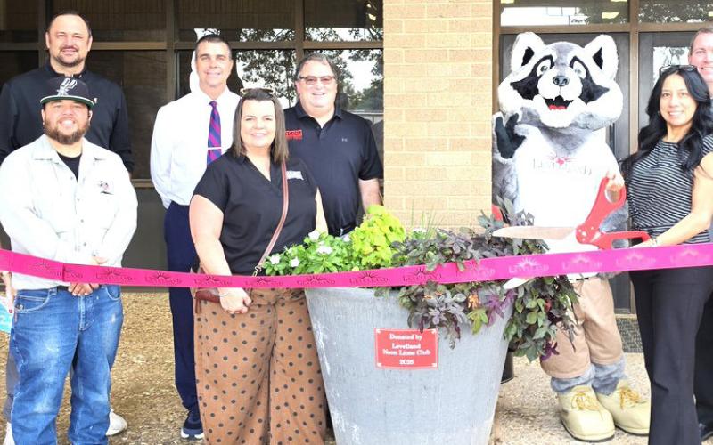 Levelland Noon Lions Club — sponsoring a planter at LHS. (front, left to right) Mary Siders, Donovan Munoz, Angie Vest, Lori Marquez, Cristal Isaack, (back) Dr. Don Heseman, Sid Gerber, Russell Vest, Litter Critter and Craig Black.
