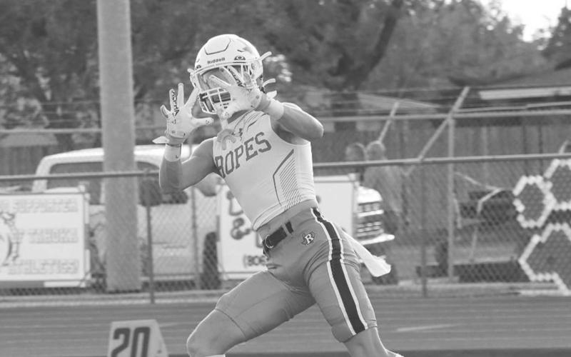 PRE-GAME - Ropes Eagle Bode Franklin was catching passes before the game started to warm up. The Eagles won in a close game 35-34 for their season opener. (Staff photo by Aalijah Soliz)