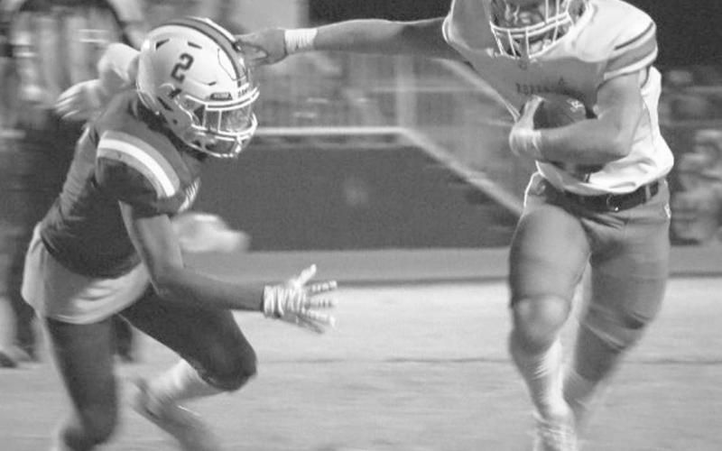 STIFFARM - Ropes Eagle Brayden Hogg stiff armed the Tahoka defender after the catch during the team’s district opener on the road. (Staff photo by Aalijah Soliz)