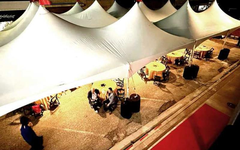 OUTDOOR TENT-- The Wallace Theater grand opening featured a large tent with adorned tables for guest to enjoy food and cocktails. The City of Levelland graciously allowed the street to be blocked off from traffic.