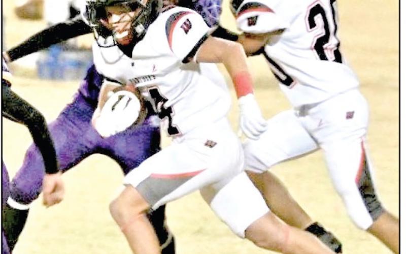 JUST RUSHIN’ IT - Whitharral freshman Hudson Prowell rushes the football during a game against Anton this past Thursday at Bulldog Stadium. Prowell would record a rushing touchdown in the game. (Photo provided by Whitharral ISD)